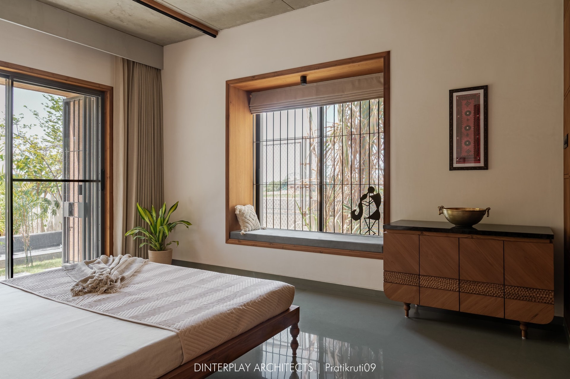 A second bedroom, organised around a deep window seat framed in timber