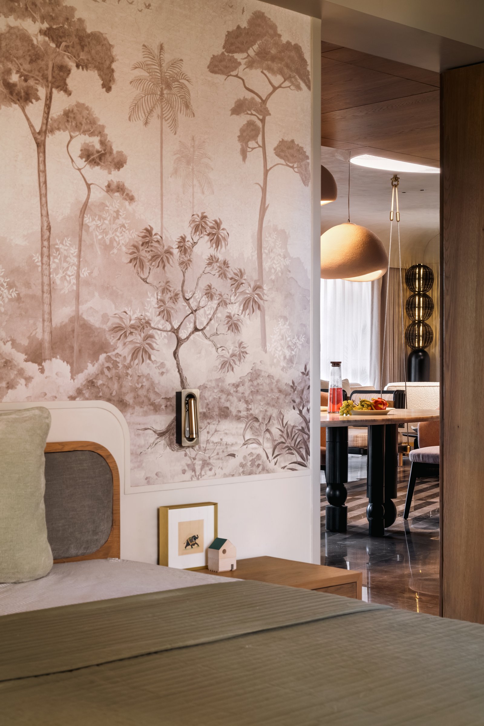 A closer view of the primary bedroom, showing the slim recessed light channel grazing the marble wall