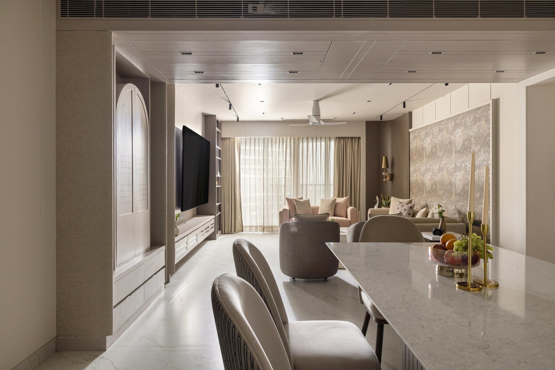 Seen from the dining end, the plan reveals a single continuous volume connecting living, media and dining