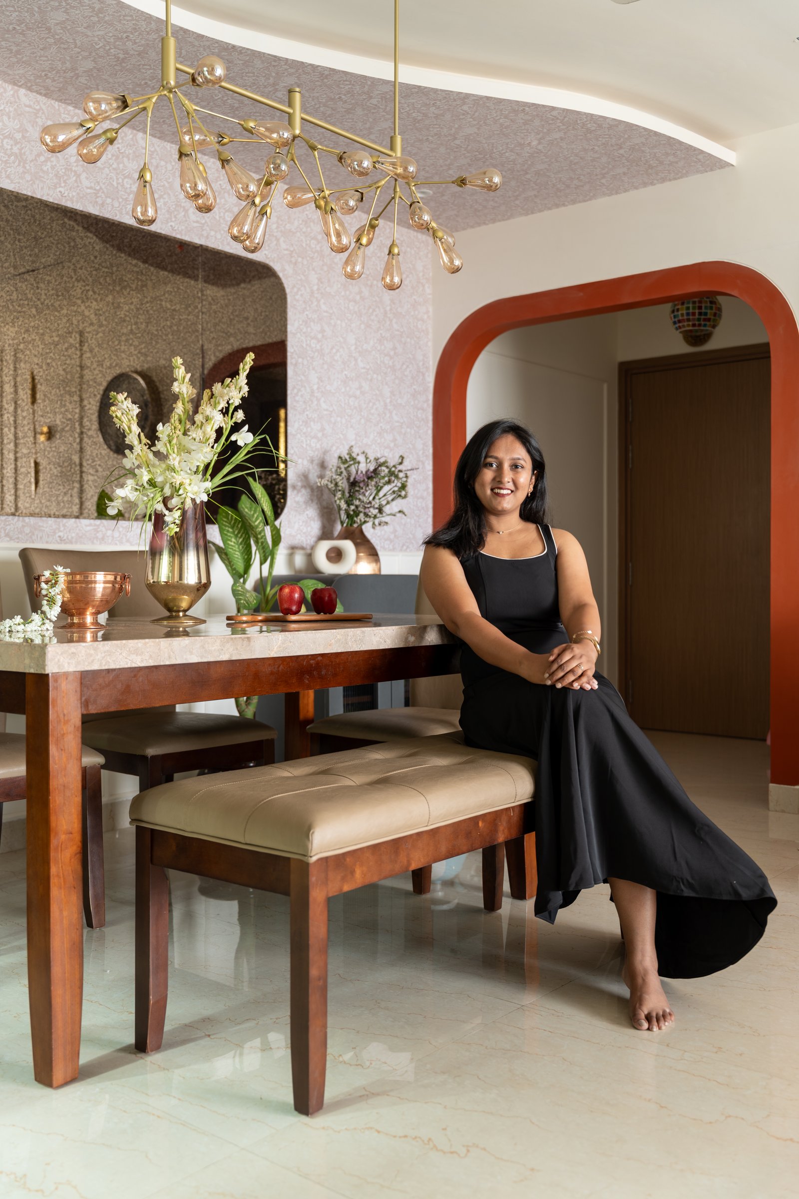 Bhakti Kuber, principal designer of Bhakti Kuber Architects and Interiors, in the dining area of Sanchit