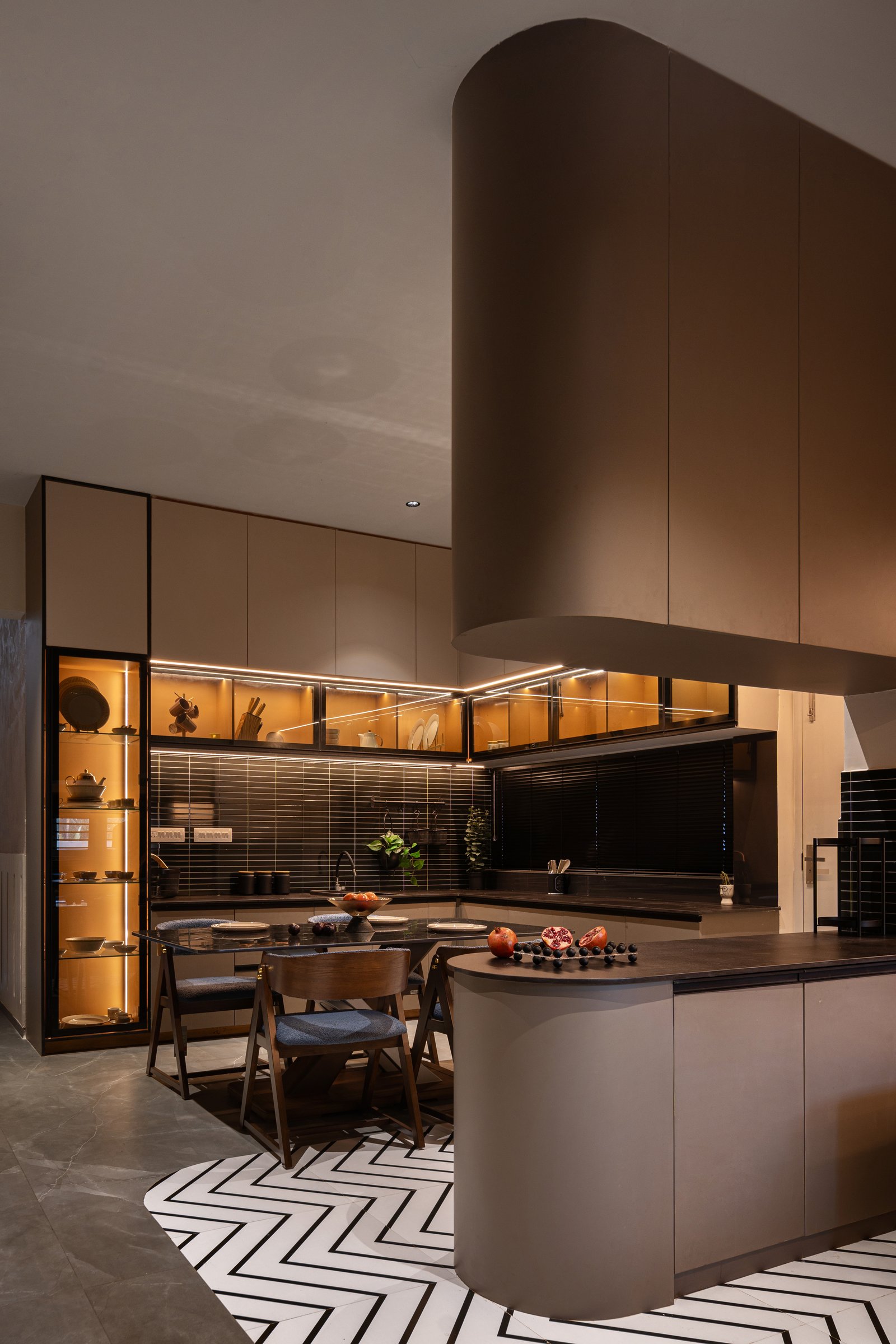 The breakfast counter, with backlit vitrines illuminating a wall of ceramics