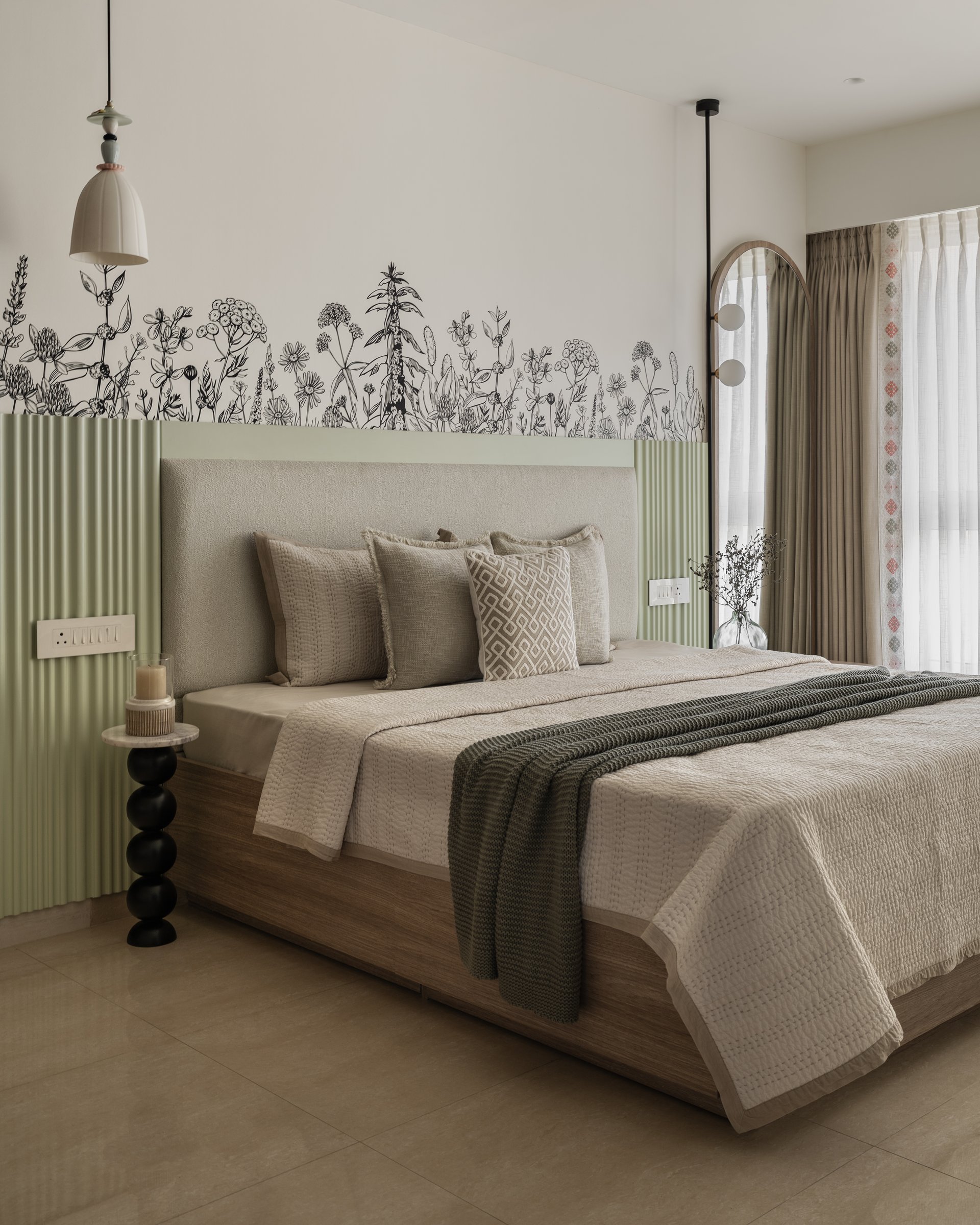 The second bedroom, where sage-green fluted panels and botanical linework define a layered composition