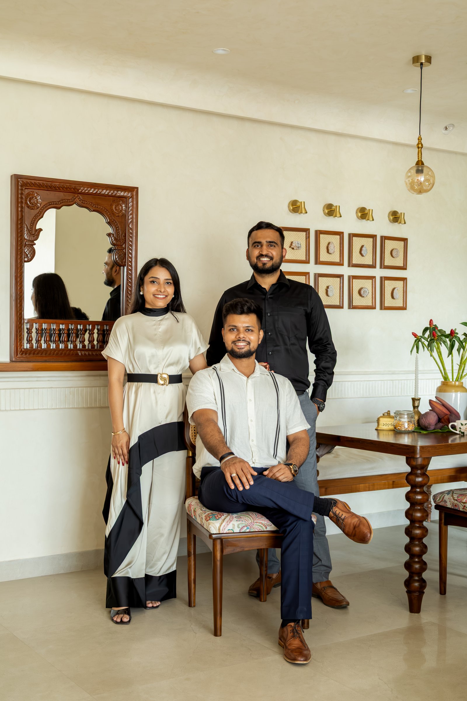 The co-founders of Elysian Design Studio, photographed within the dining area of the completed apartment